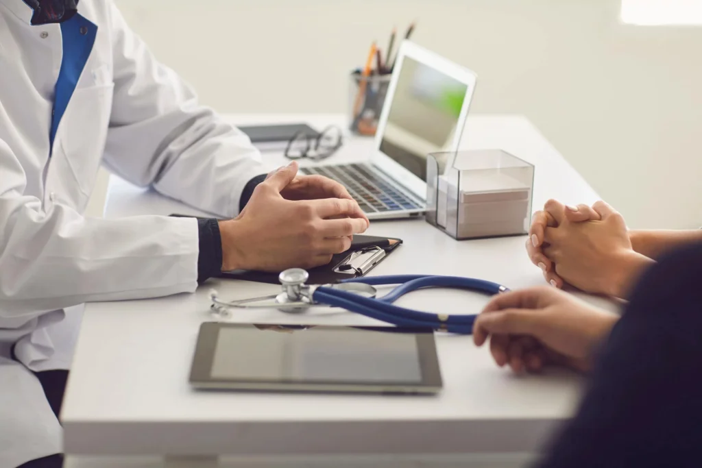 Doctor at desk with patient
